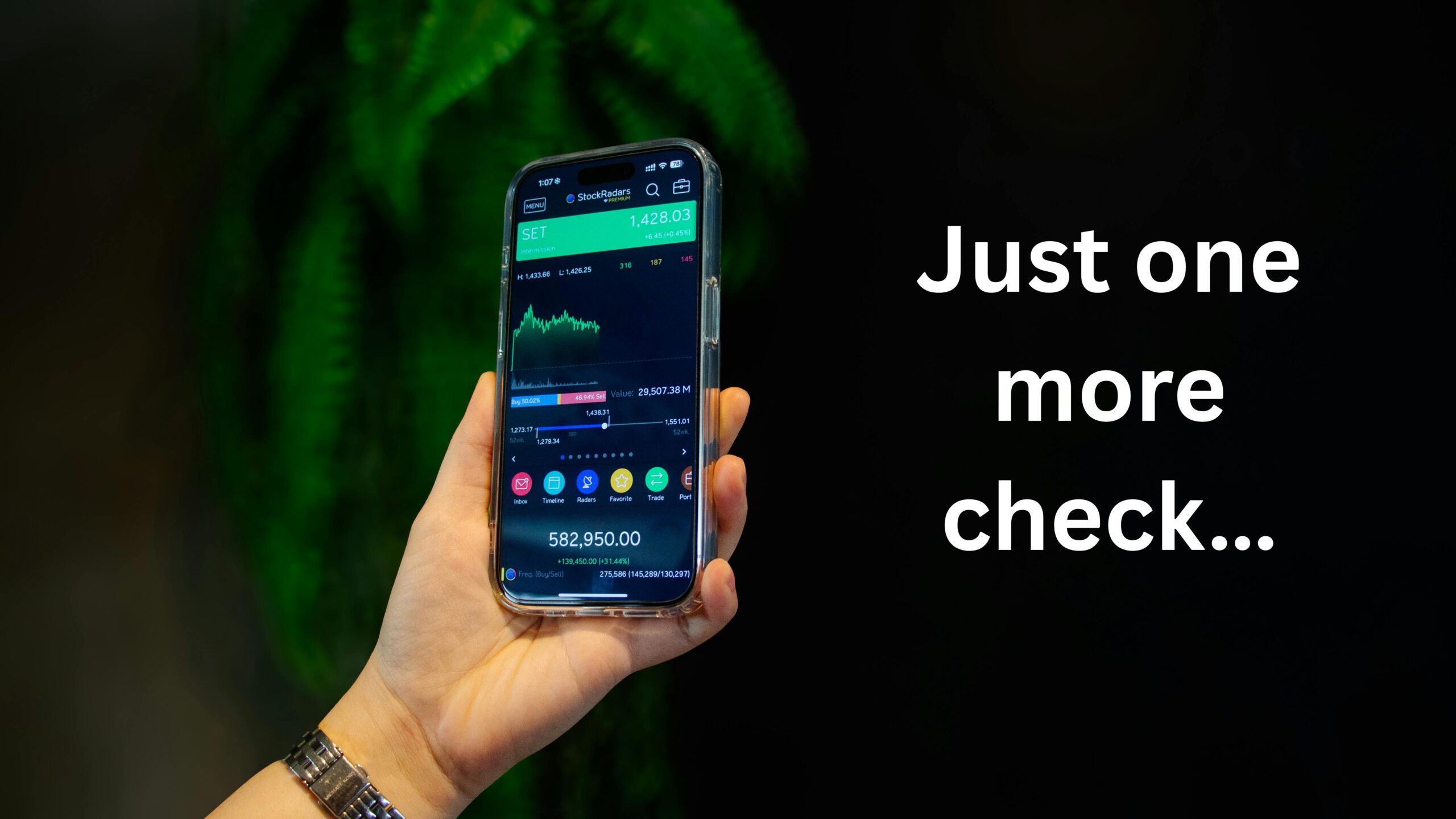 a person looking at their stock portfolio on their phone, showing how often we look at our portfolio