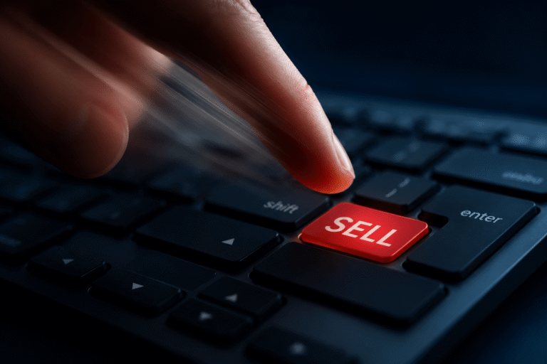 fniger pushing sell button, showing how people panic sell