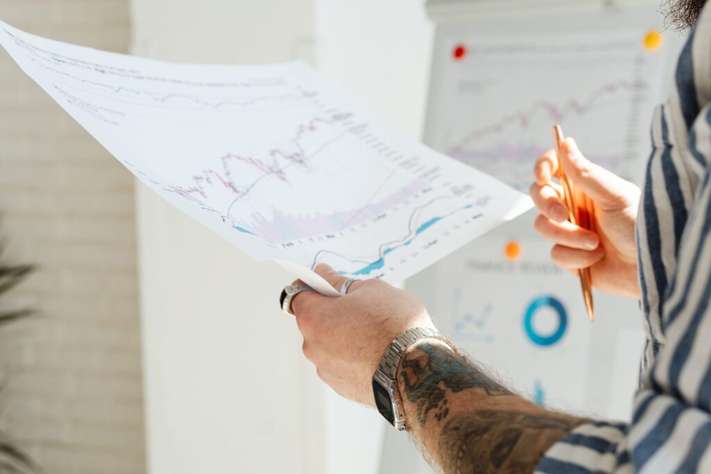 a person studying a stock sheet, like how people should study a company and its ratios